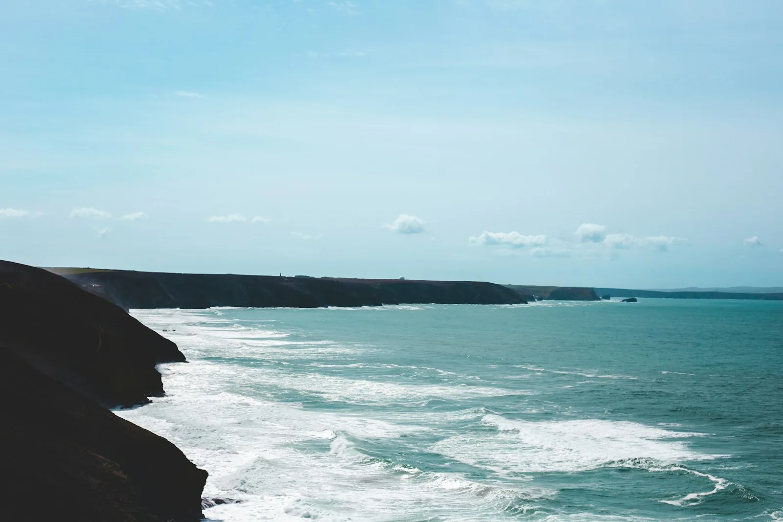 Atlantic waves breaking below the cliffs at St Agnes, Cornwall